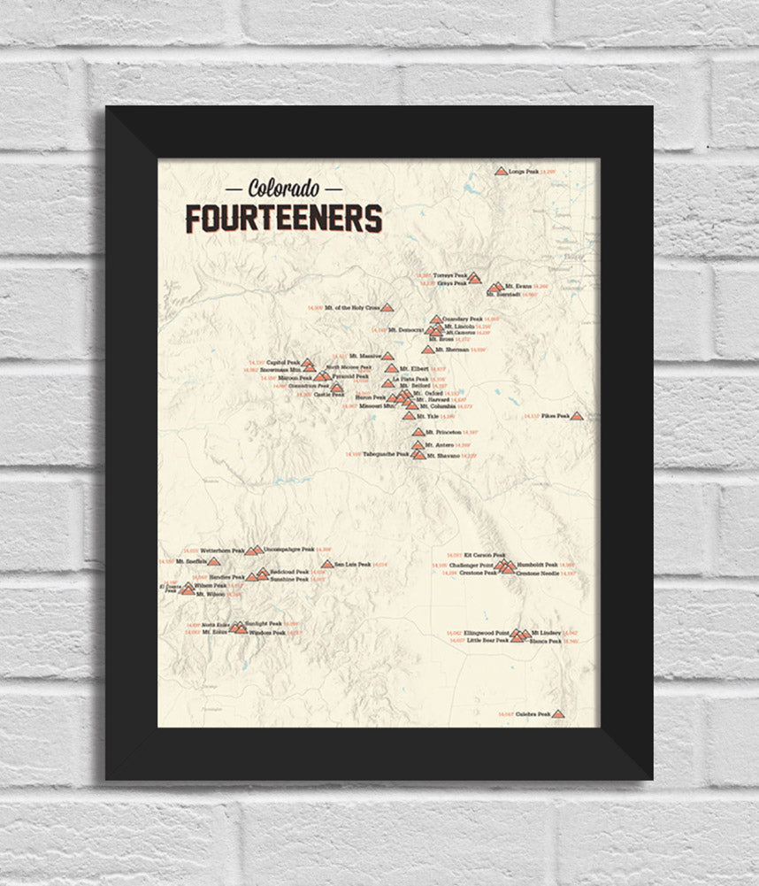 Framed map of Colorado Fourteeners on a brick wall background