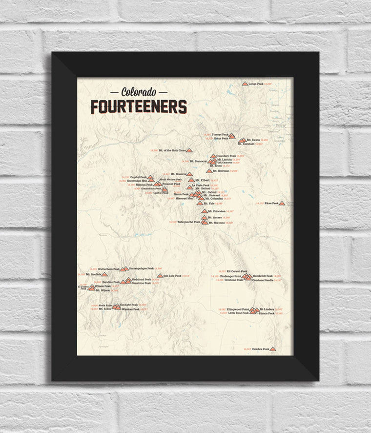Framed map of Colorado Fourteeners on a brick wall background